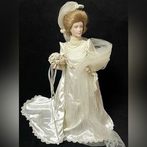 Franklin Mint porcelain Gibson Bride doll. Has never been out of the box.